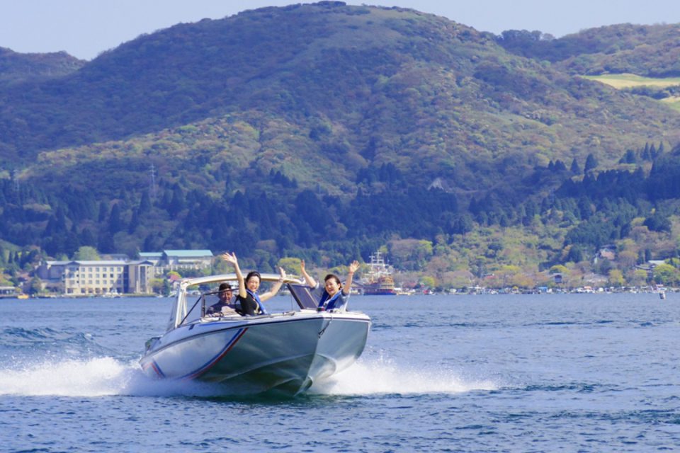 Motor boat running on the lake of Lake Ashi